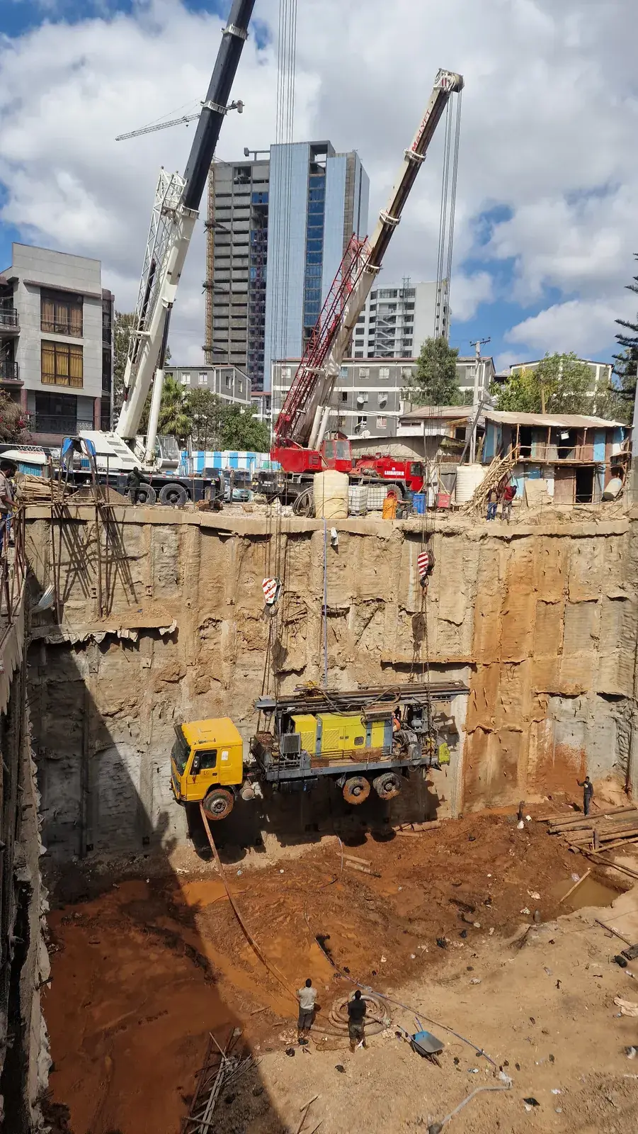 Drilling rig lowered into the 14 m deep shored excavation for CREDOCS