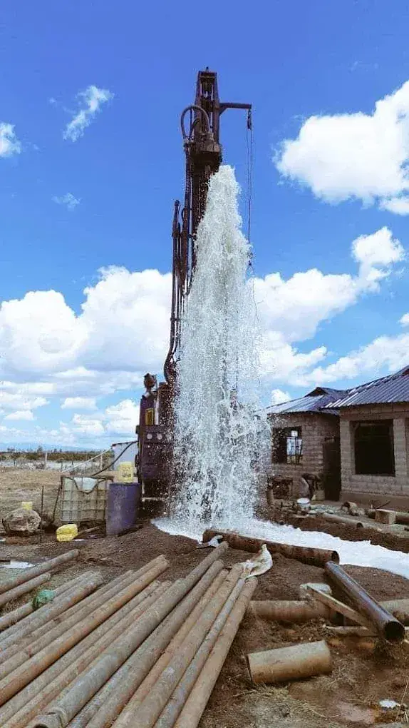 Water discharge beside a Liyat rig; illustrative site photograph, not verified as the Ovid project